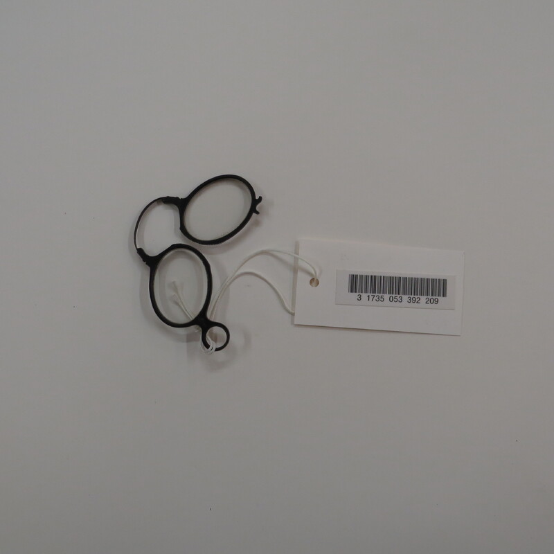 Typical eyeglasses, oval lenses in black frames with a spring clip and a pin to hold them when folded.