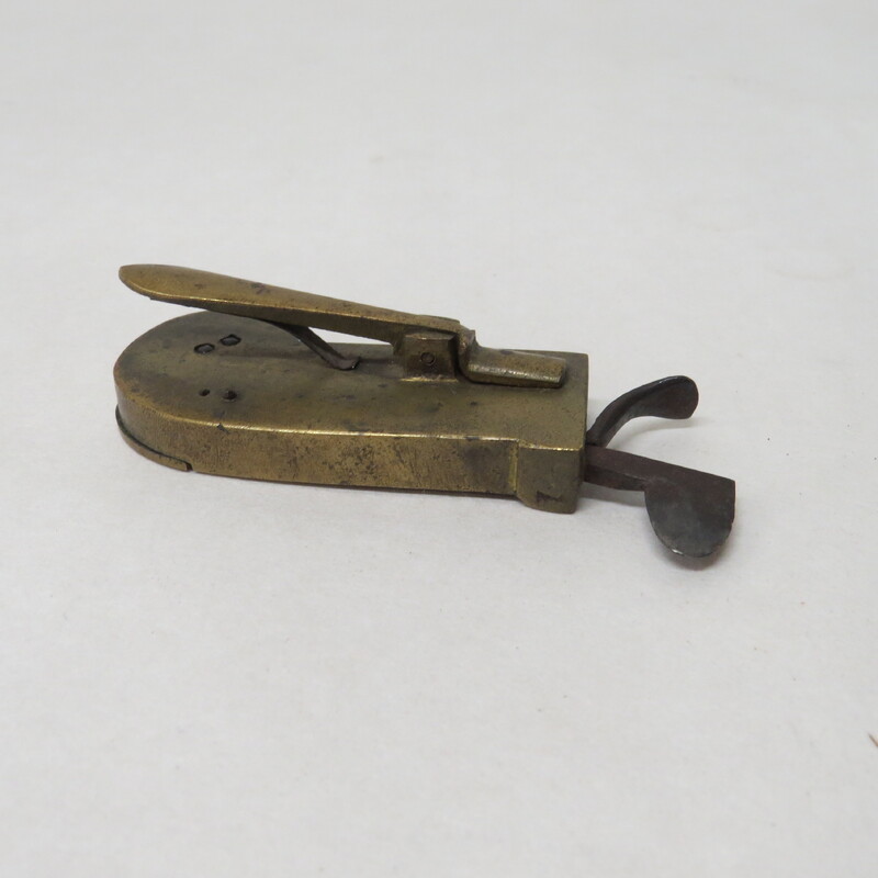 Large brass spring lancet with brass release lever and steel blade; no maker's markings.