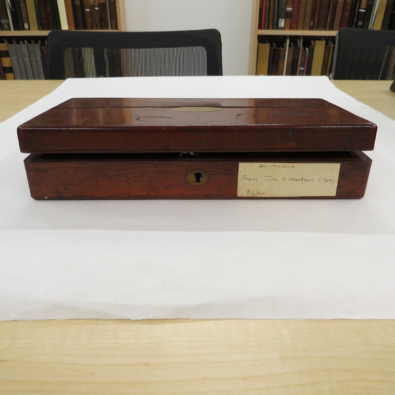 Wooden box containing lever stomach pump