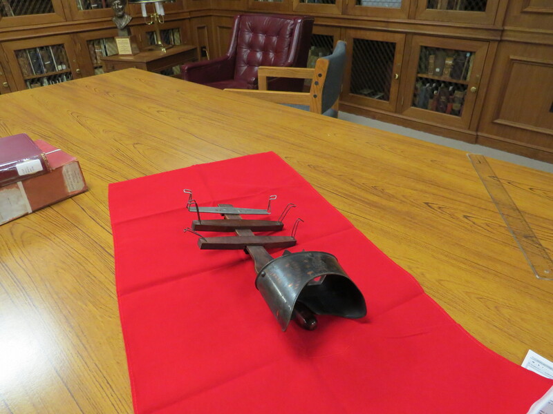 An antique viewer for stereoscopic images with 3 card holders.