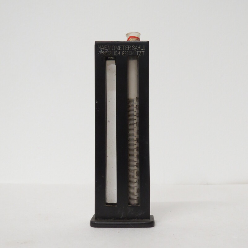 partially completed Haemometer as some black rubber tubes are damaged, black plastic round case with glass pipette inside