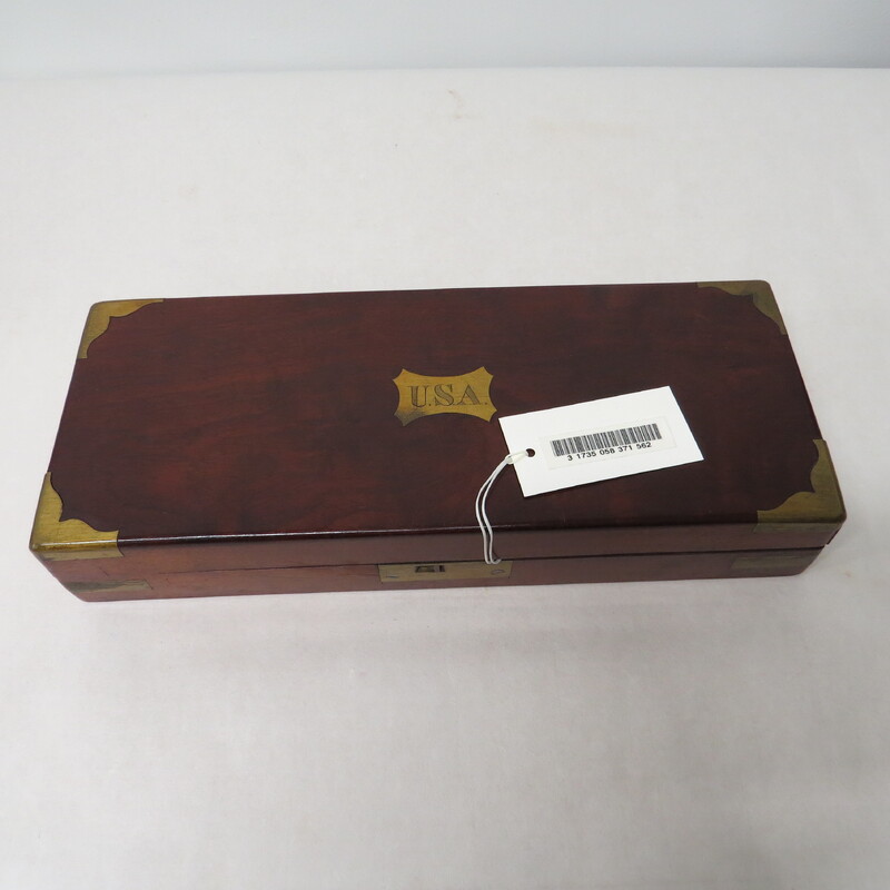 A post mortem surgical wooden tool box with USA labeled on it.