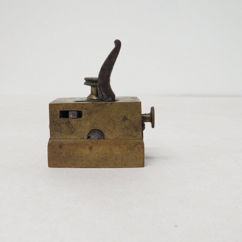 Sixteen-bladed square brass scarificator, blades arranged on three rods, cutting in the same direction. 