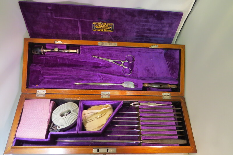 Surgical set. Set includes: 8 surgical knives, 1 artery forceps, 5 surgical needles, 1 elastic bandage, 1 tourniquet with an iron chain, 1 Galt's trephine,  1 trephine handle, 1 trepanning elevator and rasps, 1 lithotomy forceps