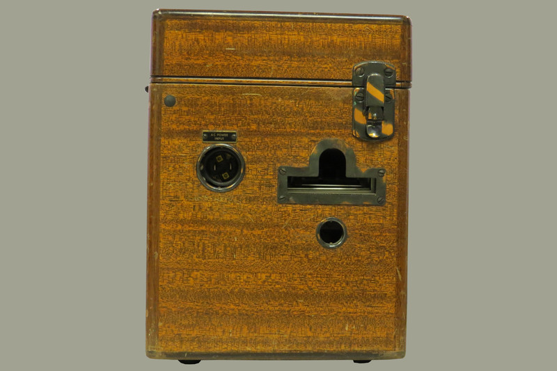 A wooden case with a handle and a brass plaque inscribed: "Dr. W.J.Armstrong." Case contains portable electrocardiograph (model 51, serial 9758).