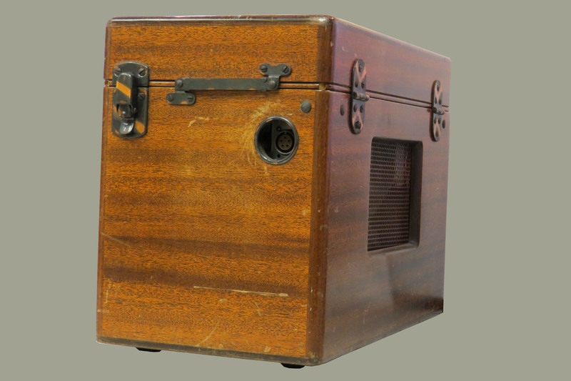 A wooden case with a handle and a brass plaque inscribed: "Dr. W.J.Armstrong." Case contains portable electrocardiograph (model 51, serial 9758).