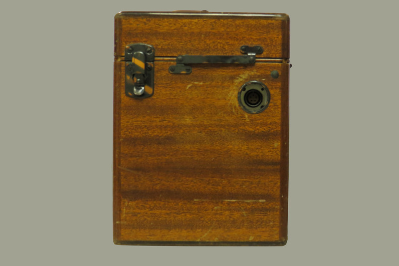 A wooden case with a handle and a brass plaque inscribed: "Dr. W.J.Armstrong." Case contains portable electrocardiograph (model 51, serial 9758).