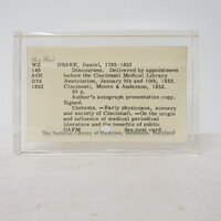 Framed catalog card for a book titled Discourses. Delivered by appointment before the Cincinnati Medical Library Association, Moore & Anderson, 1852. 93p. Author's autograph presentation copy. Signed. Content. - Early physicians, scenery and society of Cincinnati. - On the origin and influence of medical periodical literature and the benefits of public DAFM