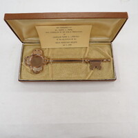 Commemorative key presented to Dr. Robert A. Moore,  Vice Chancellor of the Health Professions, by Chancellor Edward H. Litchfield at the dedication of the Health Professions Building.