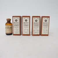 4 cardboard boxes with 1 glass sample bottle; Label reads: Liquid Court Plaster to be used on cuts, wounds, abrasions etc.