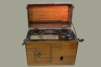 A wooden case with a handle and a brass plaque inscribed: "Dr. W.J.Armstrong." Case contains portable electrocardiograph (model 51, serial 9758).